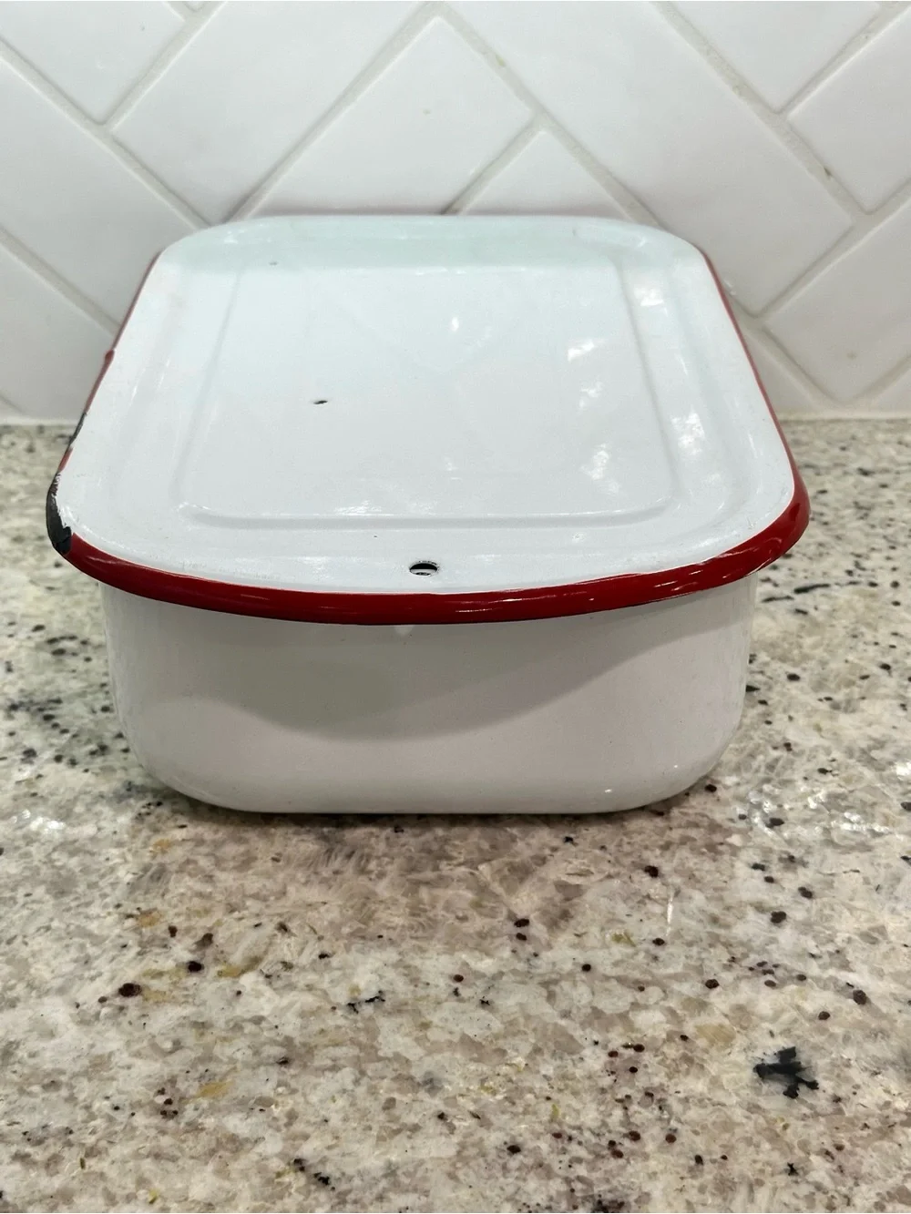 Vintage white enamel pan with red trim